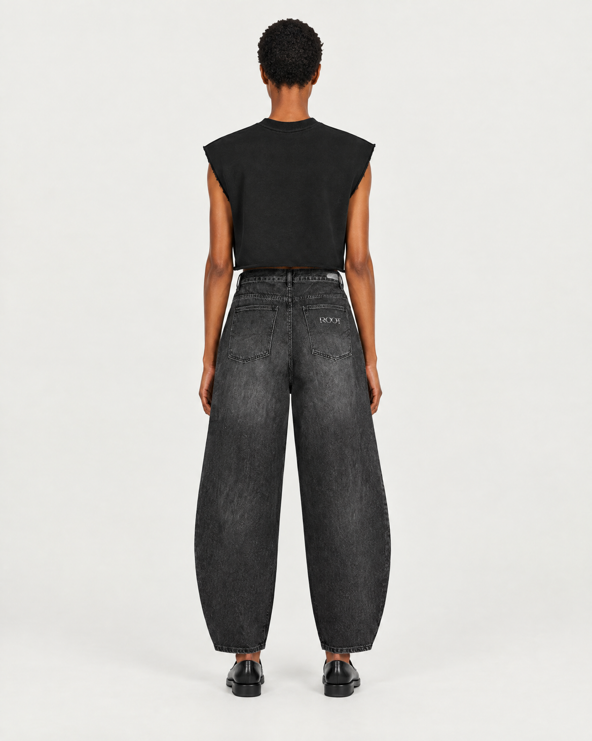 Boxy Sleeveless in Black, on model back