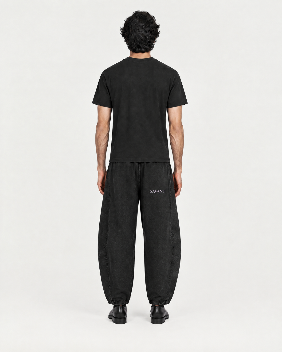 Mineral Barrel Pant in Black, on model back, worn by a man
