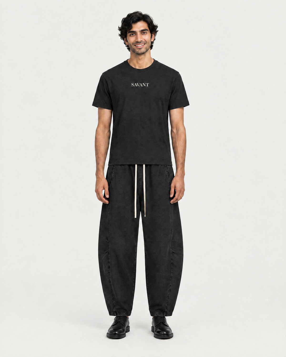 Mineral Barrel Pant in Black, on model front, worn by a man
