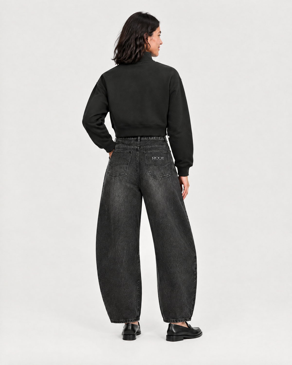 Roots Quarter Zip in Black, on model back