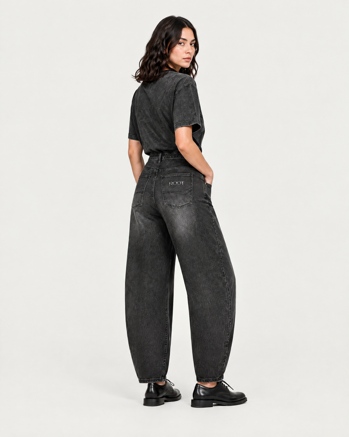 Sunfade Barrel Jean in Black, on model back three-quarter